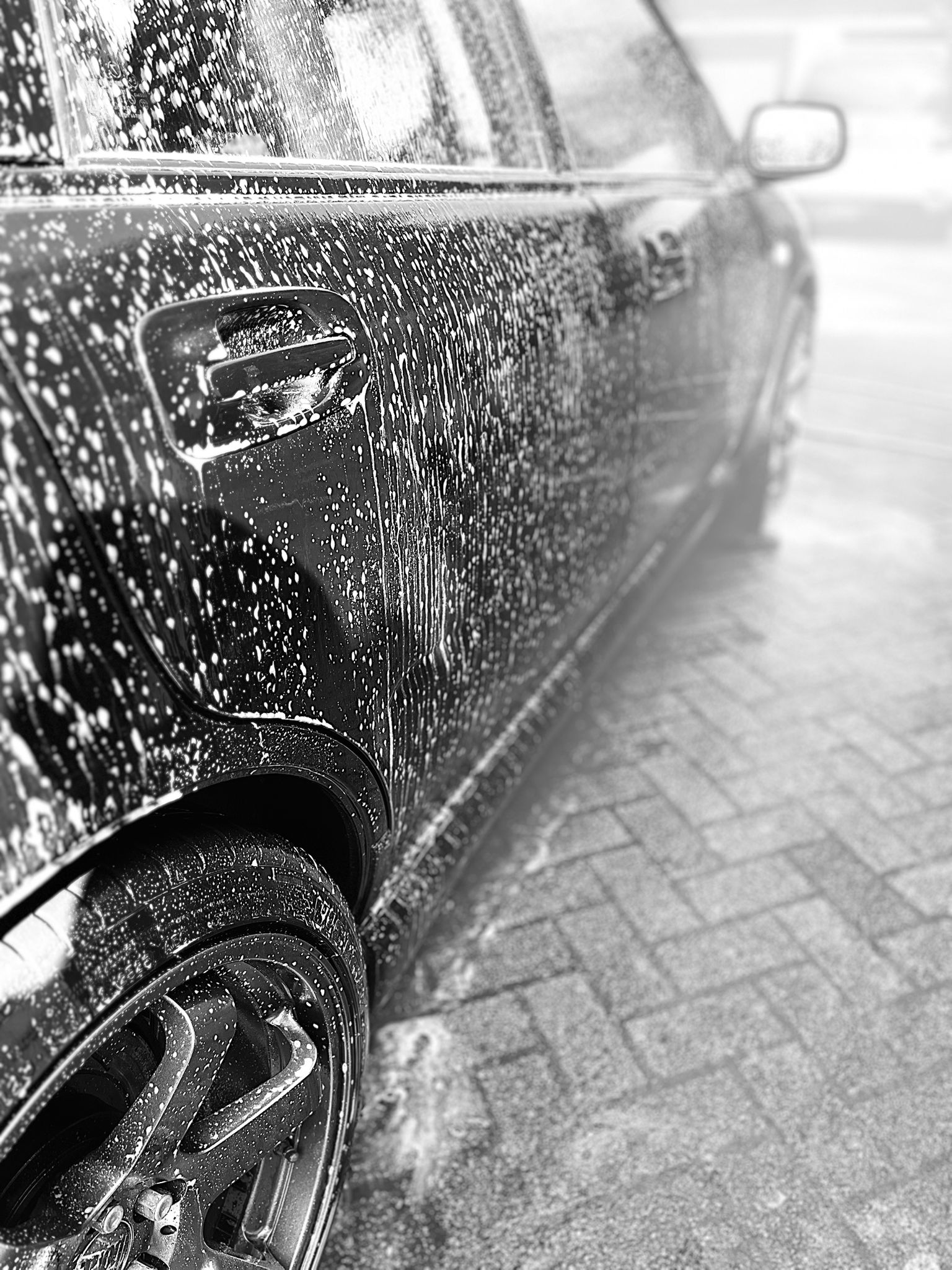 Car being washed with eco friendly shampoo